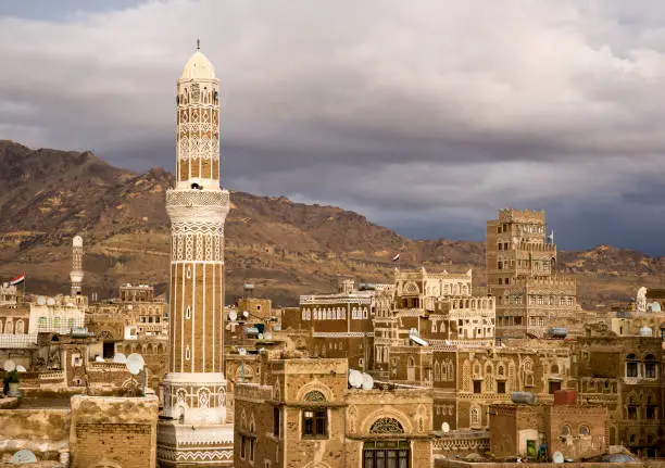 Morning light on the minarets and gypsum window patterns of the Old City of Sana'a, Yemen.