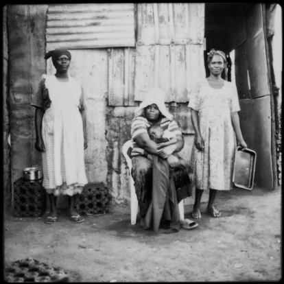 Xhosa family portrait outside their home. Mthatha, South Africa. Polaroid scan. 