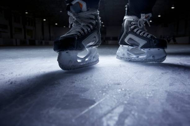 Hockey Skates on Ice  ice hockey stock pictures, royalty-free photos & images
