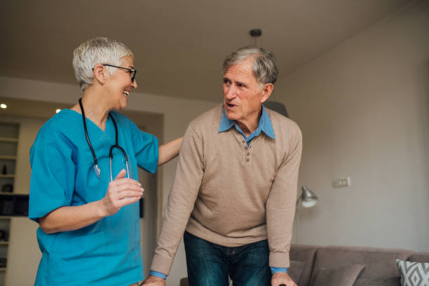 istock Happy nurse embracing patient 1083478446