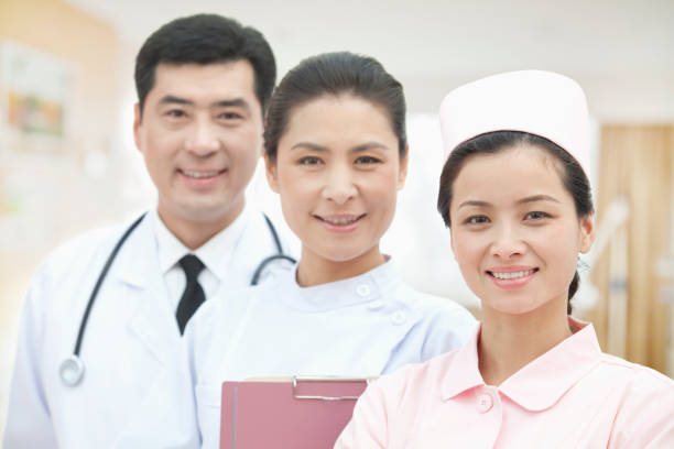 istock Smiling Chinese doctor and nurses 1083478824