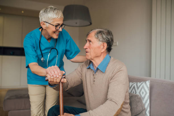 istock Nurse giving patient a cane 1083478942