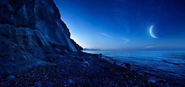 istock Night shot of mountains and sea 108347982