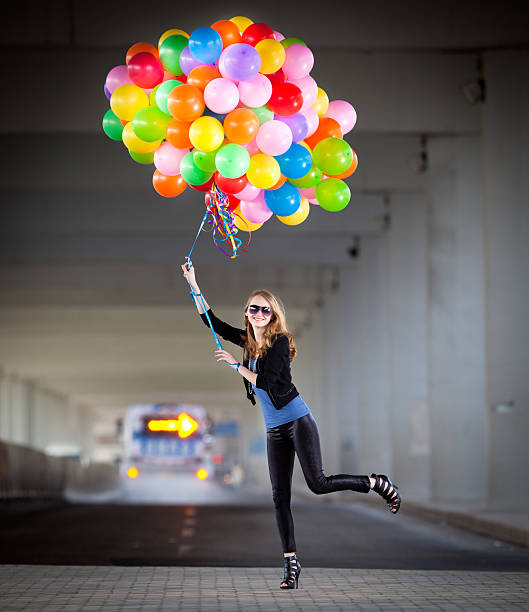 istock Woman holding many balloons 108348019