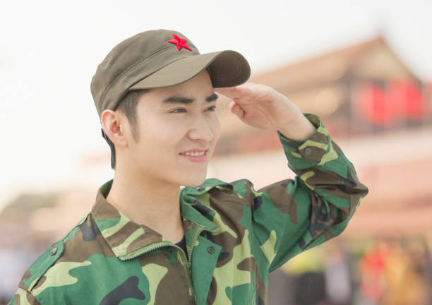 istock Chinese soldier in uniform saluting 1083480906