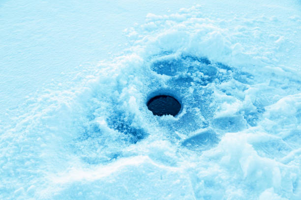 istock Ice Fishing Hole 1083481164