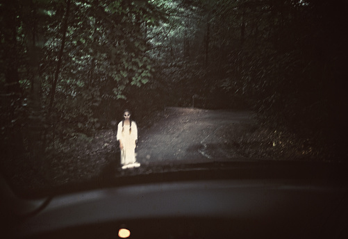Based on a North Carolina legend, this young girl was killed on a dark rainy evening such as this by a passing car. She silently pleads for a ride to find her way back home. Motion added to everything but eyes for effect. Layers and cross processing applied for effect.
[url=http://www.istockphoto.com/my_lightbox_contents.php?lightboxID=6901748] [img]http://www.alifeilluminated.com/IStock_Dark.jpg[/img] [/url]