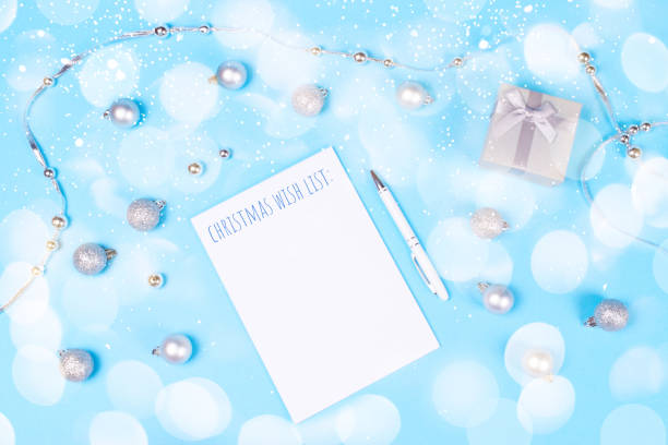 istock Holiday decoration and notebook on blue background. 1083483052
