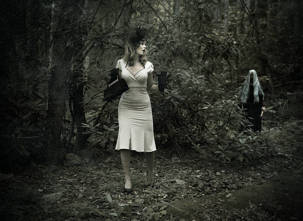 istock terrified woman in the forest chased by a witch 108348436