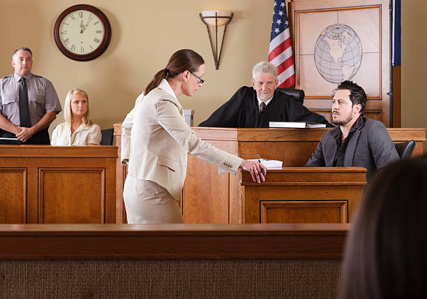 Lawyer in a Courtroom A lawyer questioning a witness in front of the judge in a courtroom.

[url=search/lightbox/8668962] [img]http://richlegg.com/istock/banners/courtroom_banner.jpg[/img][/url]
[b][url=search/lightbox/8668962]Click Here to see my other Courtroom images[/url][/b]

[url=search/lightbox/5631688] [img]http://richlegg.com/istock/banners/ron_banner.jpg[/img][/url]
[b][url=search/lightbox/5631688]Click HERE to see more of this model[/url][/b]

[url=search/lightbox/8717995] [img]http://richlegg.com/istock/banners/melinda_banner.jpg[/img][/url]
[b][url=search/lightbox/8717995]Click Here to see more of this model[/url][/b] courtroom photos stock pictures, royalty-free photos & images