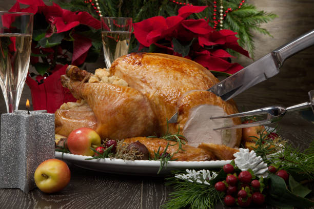 istock Carving Roasted Christmas Turkey with Grab Apples 1083484874