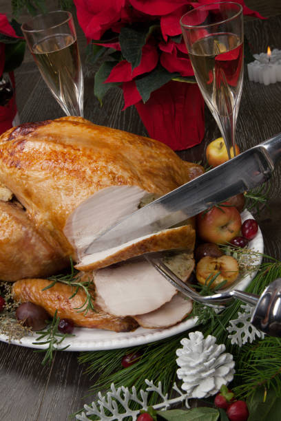 istock Carving Roasted Christmas Turkey with Grab Apples 1083484880