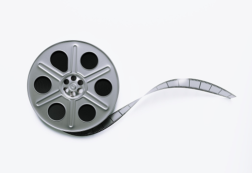 Film reel on white background. Horizontal composition with clipping path and copy space.