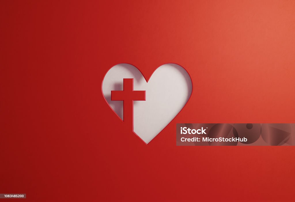 Cut Out Heart Shape With A Cross On Red Background - Good Friday And Faith Concept Cut out heart shape with a cross on red background. Great use for Good Friday and faith concepts. Horizontal composition with copy space. Religious Cross Stock Photo