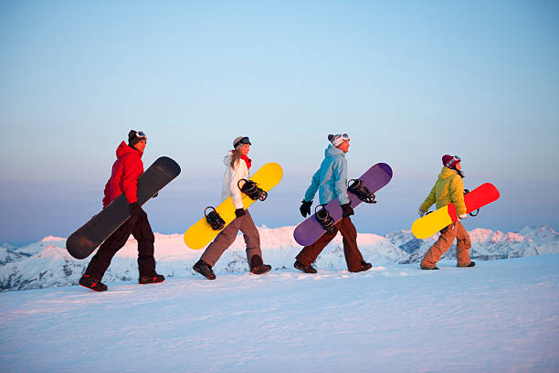 Snowboarders At Sunrise  snowboarding snowboard women snow stock pictures, royalty-free photos & images