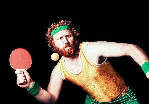 Ping Pong Action Old school ping pong player in action. He dares you to lob one. sweat band stock pictures, royalty-free photos & images