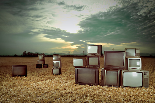 Old Televisions outdoors.