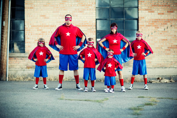 Family of Superheroes Watch out. This family of superheroes is going places. superhero photos stock pictures, royalty-free photos & images