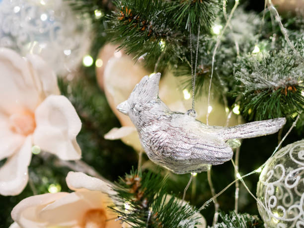 istock Elegant metal bird on silver thread, New Year decoration for Christmas tree. 1083487530