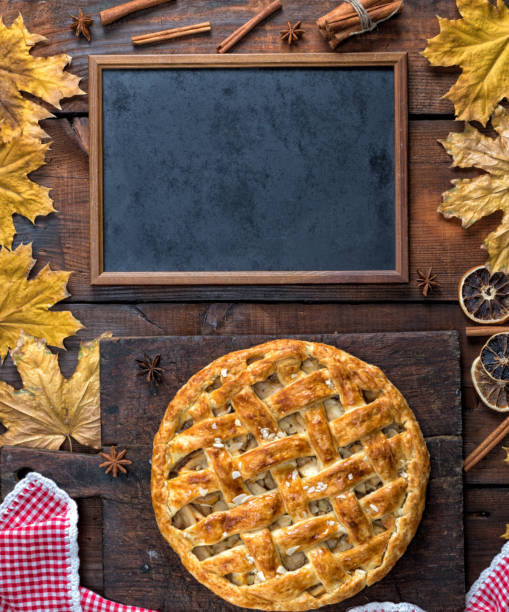 istock empty black chalk board and baked whole fruit cake 1083487806