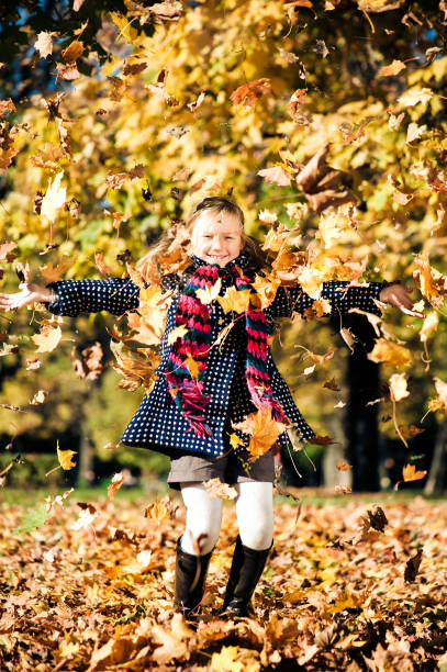 istock Little girl throwing leaves 108348909