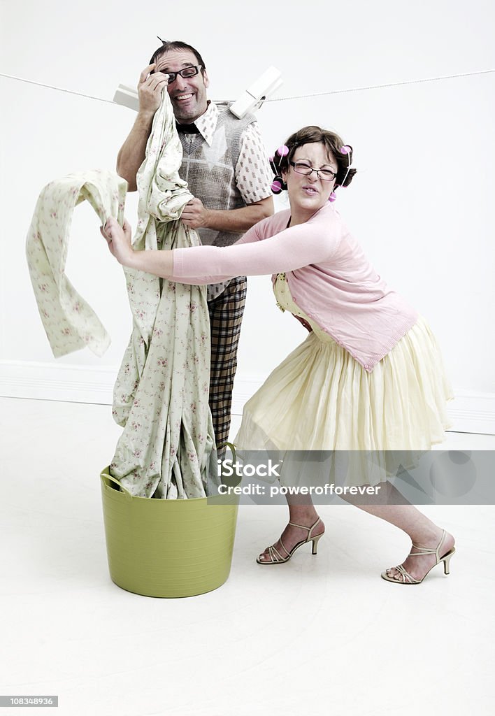 Nerd Laundry Nerdy Husband and Wife on laundry day. Hubby hung out to dry with the laundry. Nerd Stock Photo