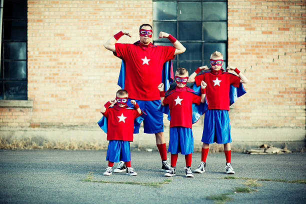 Super Boys! This super dad knows how to raise some superhero boys. happy fathers day funny stock pictures, royalty-free photos & images