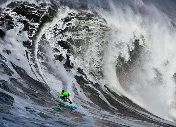 Surfing a Huge Wave stock photo