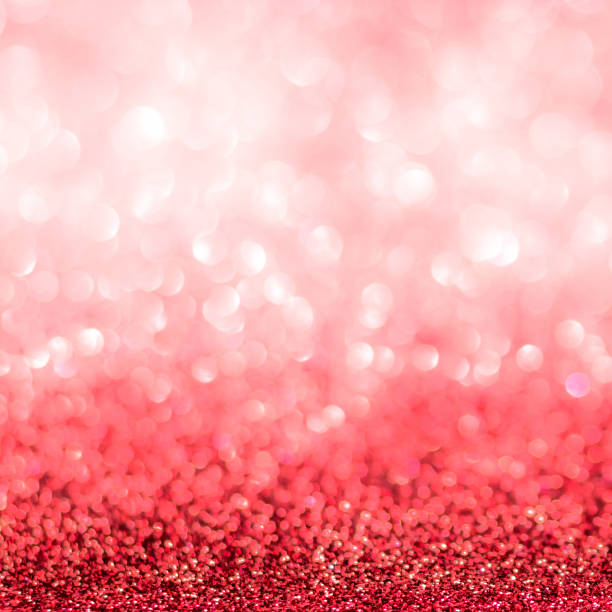 istock Red blur glitter Christmas and Valentine's day bokeh background with blurry silver white sparkling light of metallic glitz texture shimmering backdrop for holiday decoration 1083495522
