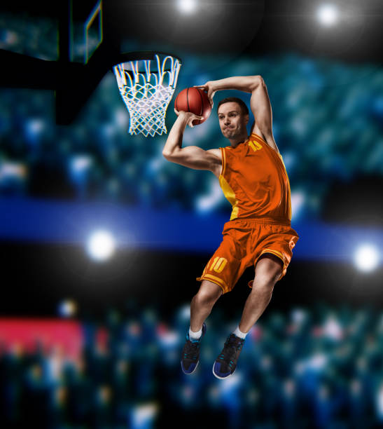 istock basketball player making slam dunk on basketball arena 1083498094