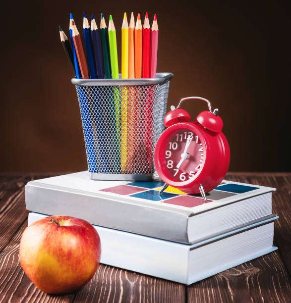 istock Education, Desk, Alarm Clock, Books, blackboard, and Pencils. Copy space. 1083498524