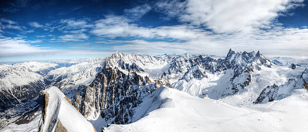 Beautiful sunset over landscape aerial view from helicopter of Glacier du Geant, Glacier du Tacul, and Mer de Glace glacier, from Mont Blanc massif in french Alps mountains in autumn season. Taken in Haute-Savoie, Auvergne-Rhone-Alpes region in France (Europe).