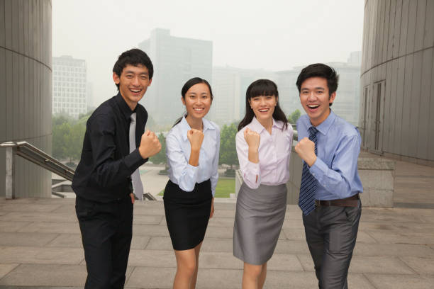 istock Chinese business people cheering together 1083502034