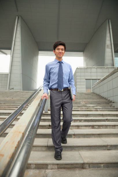 Chinese businessman on city steps
