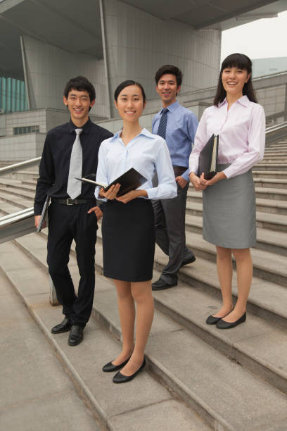 istock Chinese business people on city steps 1083502640