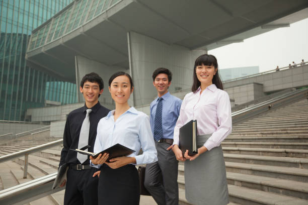 istock Chinese business people on city steps 1083502650
