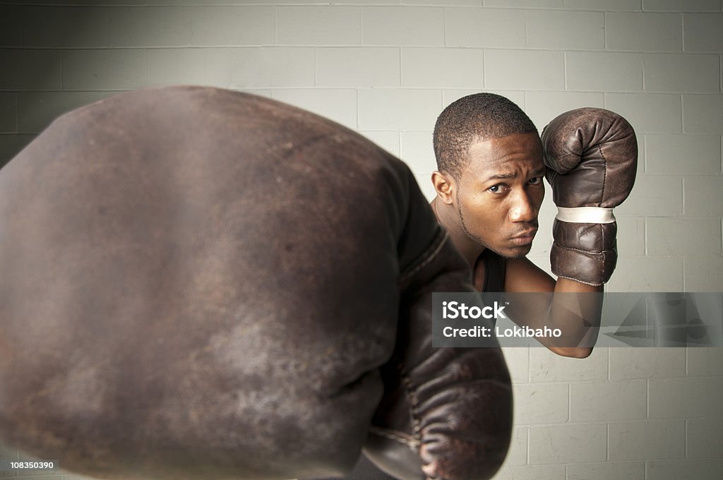 Boxer with striking glove  African Ethnicity Stock Photo