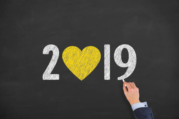 istock New Year 2019 with Heart Shape on Chalkboard Background 1083506938