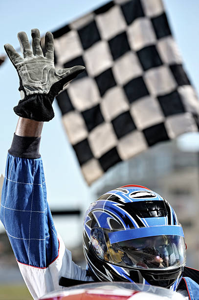Triumphant racing driver waves at crowd  sports helmet photos stock pictures, royalty-free photos & images
