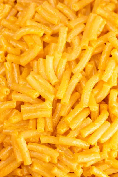 A Background of Classic Boxed Mac and Cheese