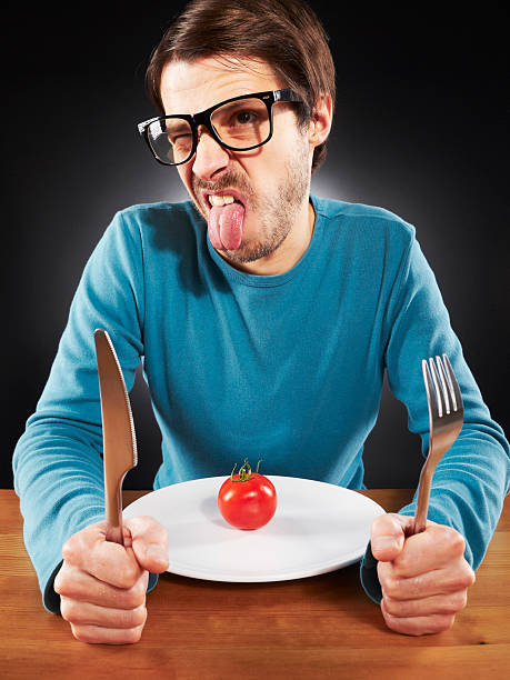 istock Skinny nerd man, hate vegetables, making faces, sticking out tongue 108350754