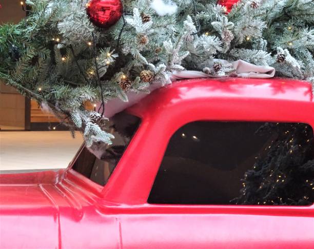 istock Christmas Tree and Greenery with Red Truck 1083510636