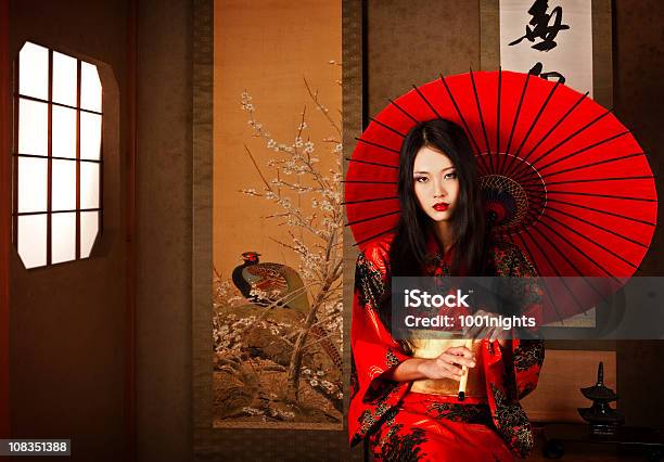 Beautiful Japanese Geisha With A Red Umbrella Stock Photo - Download Image Now - Geisha, Japan, Tradition