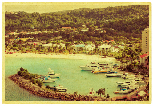 View from Belair, Carriacou, one of the islands off the coast of Grenada. In this photo the town of Hillsborough and the ocean can be seen.