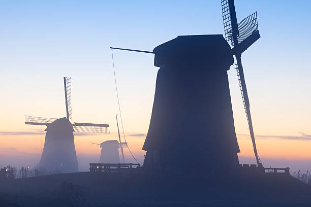 the blades of windmill in the background of sunset sky, at kinderdijk in Netherlands