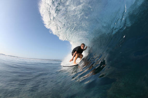 istock Surfer action shot catching a wave in the ocean 108352385