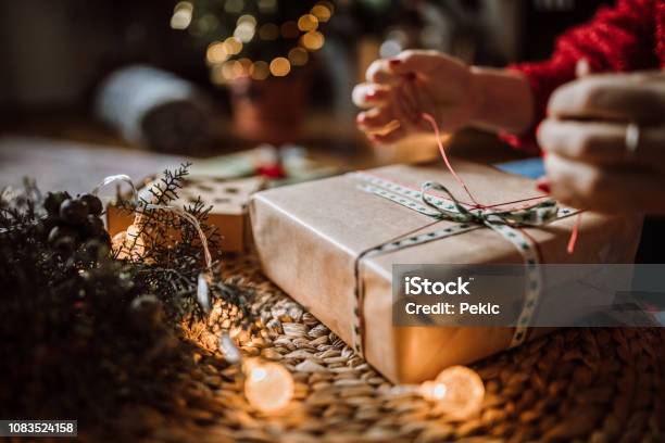 Woman Wrapping Christmas Gifts Stock Photo - Download Image Now - Christmas, Christmas Present, Gift