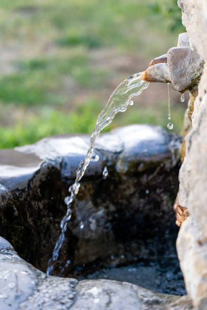 istock Water spring with stone channel in Tbilisi, Georgia 1083526002