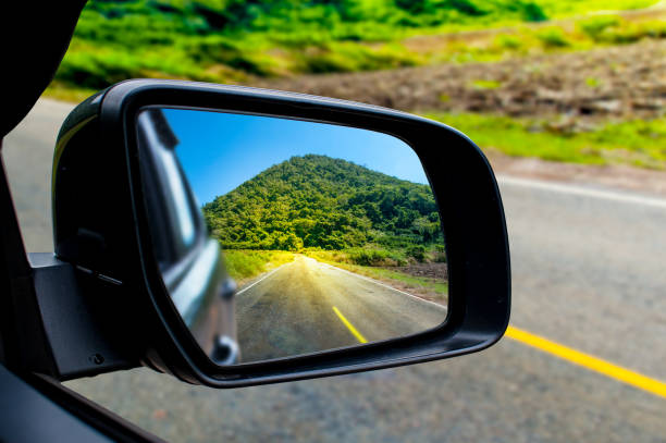 istock Landscape in the sideview mirror of a car 1083526314