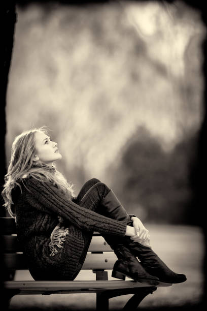 istock Woman sitting on a bench. Autumn style. 108352754
